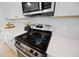 Stainless steel stove and microwave in kitchen with white subway tile backsplash at 223 Granton Edge Ln, Summerville, SC 29486