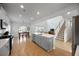 Open-concept kitchen and dining area with stainless steel appliances and a large island at 223 Granton Edge Ln, Summerville, SC 29486