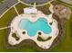 Overhead shot of the community pool, complete with lounge chairs, landscaping, and a splash pad at 223 Granton Edge Ln, Summerville, SC 29486