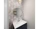 Chic powder room with designer wallpaper, round mirror, and modern vanity at 223 Granton Edge Ln, Summerville, SC 29486