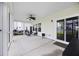 This screened porch is the perfect place to relax with its neutral furniture and access to the back yard at 223 Granton Edge Ln, Summerville, SC 29486