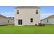 Backyard featuring manicured lawn and the home's white siding at 2242 Macallan Blvd, Ravenel, SC 29470