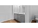 A bathroom featuring dual sinks, wood look flooring, and a toilet, offering a functional space at 2242 Macallan Blvd, Ravenel, SC 29470