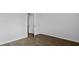 Bedroom has wood flooring and neutral walls with a white door at 2242 Macallan Blvd, Ravenel, SC 29470