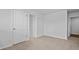 A bedroom featuring neutral carpet, fresh paint, and multiple doorways, offering a versatile living space at 2242 Macallan Blvd, Ravenel, SC 29470