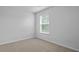 Bright bedroom with neutral carpet and a window with blinds at 2242 Macallan Blvd, Ravenel, SC 29470