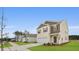 Street view of charming two-story homes with manicured lawns and driveways at 2242 Macallan Blvd, Ravenel, SC 29470