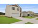 Beautiful two-story home featuring a two-car garage and a landscaped yard at 2242 Macallan Blvd, Ravenel, SC 29470