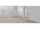 A upstairs hallway featuring neutral carpet and multiple doors, connecting the upstairs rooms of this home at 2242 Macallan Blvd, Ravenel, SC 29470