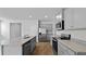 Open concept kitchen featuring granite countertops, stainless steel appliances, and island sink at 2242 Macallan Blvd, Ravenel, SC 29470