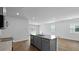 Open concept kitchen featuring granite countertops, stainless steel appliances, and island sink at 2242 Macallan Blvd, Ravenel, SC 29470