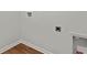 A laundry room with wood look flooring, and hookups for a washer and dryer at 2242 Macallan Blvd, Ravenel, SC 29470