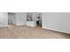 Spacious living area with a modern kitchen featuring gray cabinets and an island at 2242 Macallan Blvd, Ravenel, SC 29470