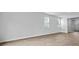 Bright living room showcasing wood floors and natural light from multiple windows at 2242 Macallan Blvd, Ravenel, SC 29470