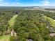 Expansive aerial view showcasing lush golf courses, tranquil water, and a dense forest at 2500 The Bent Twig, Seabrook Island, SC 29455