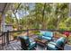 Inviting outdoor deck featuring comfortable seating and a serene wooded backdrop at 2500 The Bent Twig, Seabrook Island, SC 29455