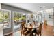Cozy dining area with wood table and outdoor access to a lovely deck and backyard at 2500 The Bent Twig, Seabrook Island, SC 29455