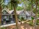 Charming home exterior with a deck, complemented by lush, tropical landscaping at 2500 The Bent Twig, Seabrook Island, SC 29455