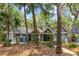 Inviting home exterior featuring a well-maintained lawn and lush landscaping at 2500 The Bent Twig, Seabrook Island, SC 29455