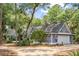 Lovely home exterior with a two-car garage and well-manicured landscaping and circular driveway at 2500 The Bent Twig, Seabrook Island, SC 29455
