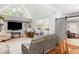 Bright living room featuring high ceilings, large windows, and comfortable seating at 2500 The Bent Twig, Seabrook Island, SC 29455
