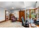 Comfortable home office with natural light, wood accents, and functional desk space at 2500 The Bent Twig, Seabrook Island, SC 29455