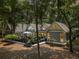 Charming home featuring a deck and wooded surroundings, offering privacy and a peaceful outdoor space at 2500 The Bent Twig, Seabrook Island, SC 29455