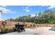 Backyard showcasing a barbecue, lounge chairs, patio, tall trees, and a partial view of the in-ground pool at 256 Fiddleback Dr, Summerville, SC 29486