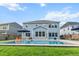 Backyard with an in-ground pool, patio furniture, manicured landscaping and a well-maintained lawn at 256 Fiddleback Dr, Summerville, SC 29486