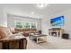 Comfortable basement with a fireplace, sofa, and entertainment center at 256 Fiddleback Dr, Summerville, SC 29486