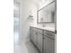 Bathroom featuring marble counters, soft grey cabinets, and a modern faucet at 256 Fiddleback Dr, Summerville, SC 29486