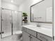 Clean and modern bathroom with a glass-enclosed shower and white marble accents at 256 Fiddleback Dr, Summerville, SC 29486