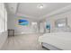 Large bedroom featuring tray ceiling and large windows at 256 Fiddleback Dr, Summerville, SC 29486