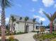 Modern farmhouse-style community center with palm trees and paved walkways with nearby playground and parking at 256 Fiddleback Dr, Summerville, SC 29486