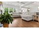 Spacious living room with hardwood floors, large windows, and comfortable sectional sofa at 256 Fiddleback Dr, Summerville, SC 29486