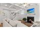 Cozy living room with a fireplace, coffered ceilings, and staircase access at 256 Fiddleback Dr, Summerville, SC 29486