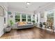 Sun room with large windows, natural light, and hardwood floors at 256 Fiddleback Dr, Summerville, SC 29486