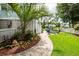 Well-designed backyard with a stone walkway leading to a fire pit and an outdoor bar at 2734 Battle Trail Dr, Johns Island, SC 29455