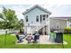Lovely backyard featuring a patio with a fire pit, bar, and a staircase leading to the second floor at 2734 Battle Trail Dr, Johns Island, SC 29455