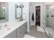 Bright bathroom with dual vanity, quartz countertop, modern fixtures, and walk-in closet at 2734 Battle Trail Dr, Johns Island, SC 29455