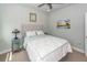 Cozy bedroom featuring neutral walls, carpet, ceiling fan, and stylish starfish patterned bedding at 2734 Battle Trail Dr, Johns Island, SC 29455