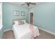 A relaxing bedroom features light blue walls, carpet flooring, and comfortable bed with wall decor at 2734 Battle Trail Dr, Johns Island, SC 29455