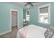 Cozy bedroom with a comfortable bed, a sitting chair, and a view from the bright windows at 2734 Battle Trail Dr, Johns Island, SC 29455