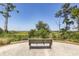 Scenic community bench overlooking marsh and trees and blue skies at 2734 Battle Trail Dr, Johns Island, SC 29455