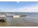 Community dock for fishing and watersports with a crab trap and boat lift in view at 2734 Battle Trail Dr, Johns Island, SC 29455