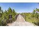 Community entrance with No Trespassing sign with a wooden boardwalk and natural setting at 2734 Battle Trail Dr, Johns Island, SC 29455