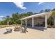 Beautiful community firepit with Adirondack chairs, covered picnic area and blue skies overhead at 2734 Battle Trail Dr, Johns Island, SC 29455