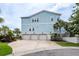 Exterior of blue two-story home with a three-car garage at 2734 Battle Trail Dr, Johns Island, SC 29455