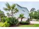 Exterior of blue two-story home with a three-car garage at 2734 Battle Trail Dr, Johns Island, SC 29455