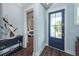 Light-filled foyer with stylish decor, hardwood floors, and an open view into the main bedroom at 2734 Battle Trail Dr, Johns Island, SC 29455